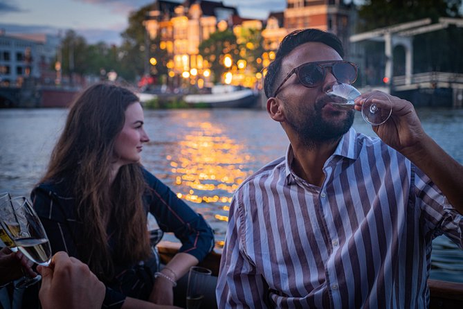 Amsterdam Champagne Private Canal Cruise - Passing Magere Brug and the canal sights
