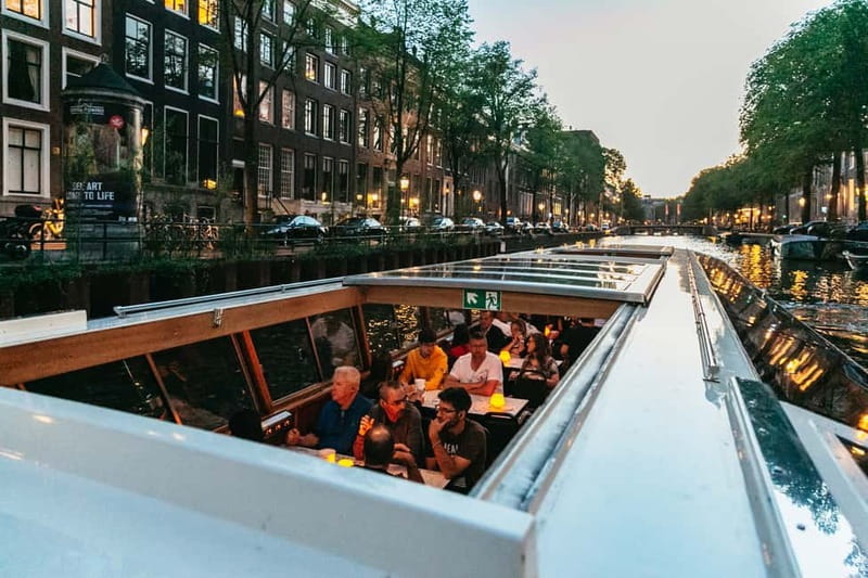 Amsterdam: Evening Cruise with Optional Wine and Snacks - Audio guide, live commentary, and seat choice
