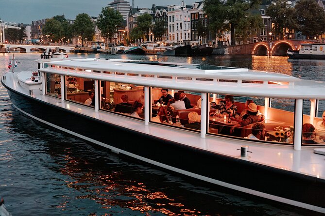 Amsterdam Small-Group Evening Canal Cruise Including Wine, Craft Beer, Cheese - Historic canals, bridges, and the city center
