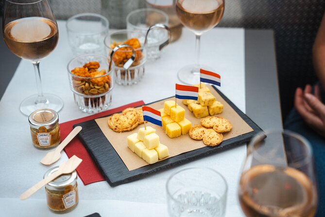 Amsterdam: Wine and Cheese Evening Cruise - Cheese boards, bread, and Dutch flavor