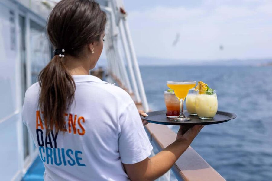 Athens: Swimming Cruise with Lunch, Wine & Live DJ on Board - The return cruise and DJ