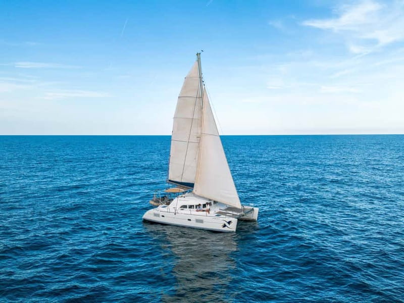 Barcelona: Catamaran Cruise w/ Sailing, Wine, & Tapa - Leaving Port Vell aboard the OPA catamaran