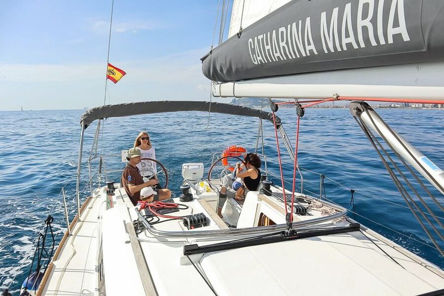 Barcelona: Coastline Boat Trip with Snacks and Cava - What happens during the two-hour sailing