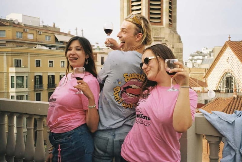 Barcelona: Fun & Unpretentious Rooftop Wine Tasting - A rooftop setting with a Barcelona backdrop