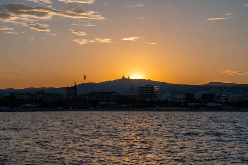 Barcelona: Sunset Catamaran Cruise with Wine and Tapa - Sunset along the Barcelona coast