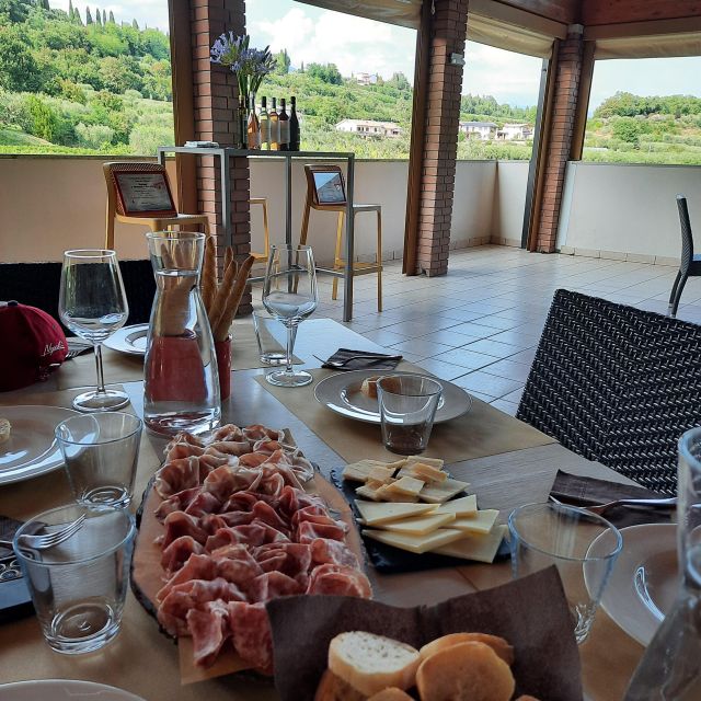 Bardolino: Vineyard Tour with Wine, Olive Oil & Food Tasting - Olive oil, cheese and local cold cuts