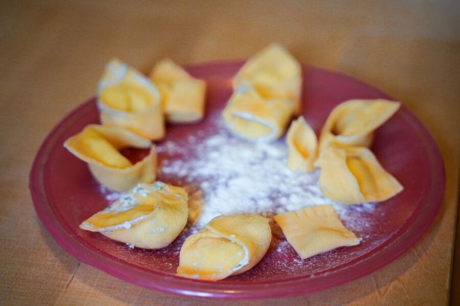 Bologna: Pasta Tagliatelle al Ragu Cooking Class with Wine - Eating tagliatelle, tortellini, and ragù