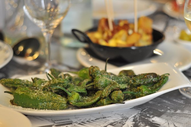 Born to Eat: Gourmet Tapas & Wine Small Group Tour in Old Barcelona - Mercat del Born and the city beneath it