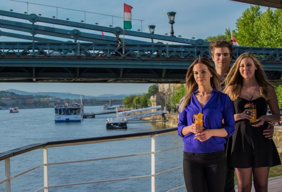 Budapest: 1 hr Sunshine Booze Cruise with Prosecco - The National Theater and the changing southern view