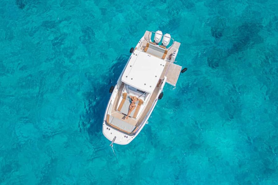 Cagliari: Luxury Motorboat Tour with 3 Swim Stops & Wine - The opening cruise past Poetto and the Devil’s Saddle