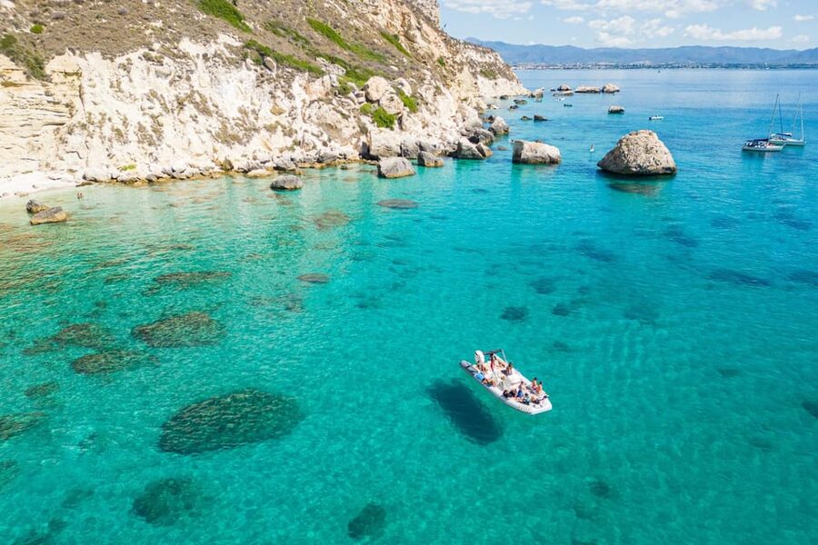 Cagliari: Zodiac Boat Tour, 3-4 SwimStops, Wine & Snorkeling - Wine, music, and the social mood