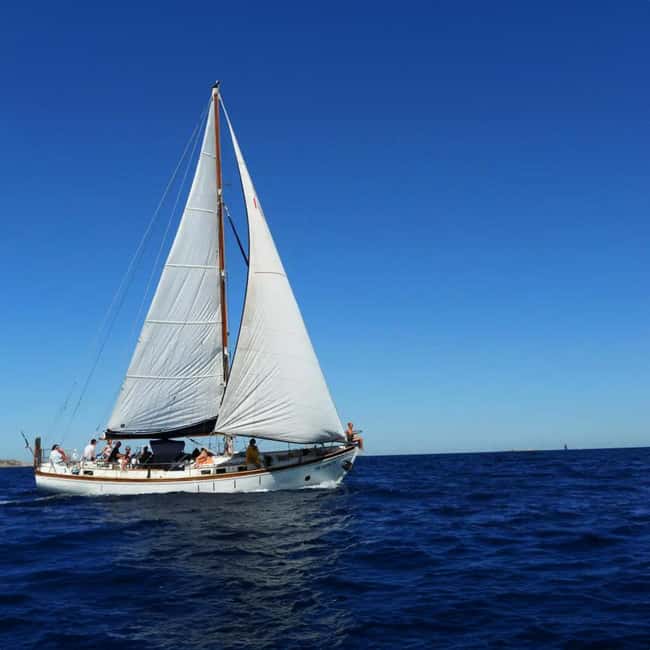 Catania: Boat Trip with Aperitif, Prosecco and Snorkeling - Aci Castello from the water