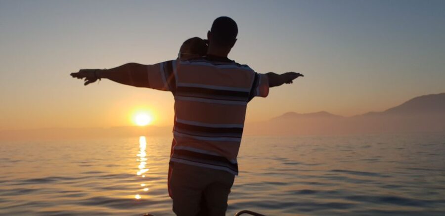 Estepona: Sunset boat trip & Cava & Tapa - Watching for dolphins near the boat
