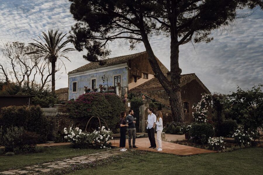 Etna Urban Winery, Vineyard Walk & Sunset Tasting Dinner - A courtyard finish with Mount Etna in view