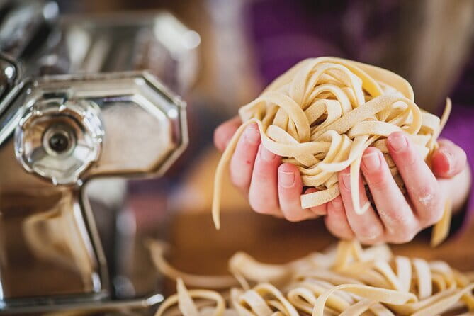 Florence: Pasta Cooking Class with Unlimited Wine - Making pasta from flour inside a medieval tower