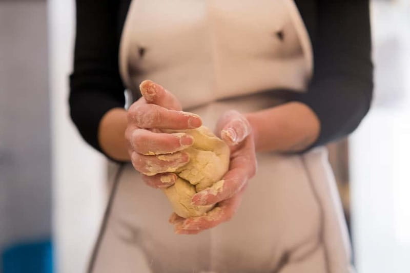 Florence: Premium Pasta Cooking Class with Tiramisu & Wine - Folding spinach and ricotta ravioli
