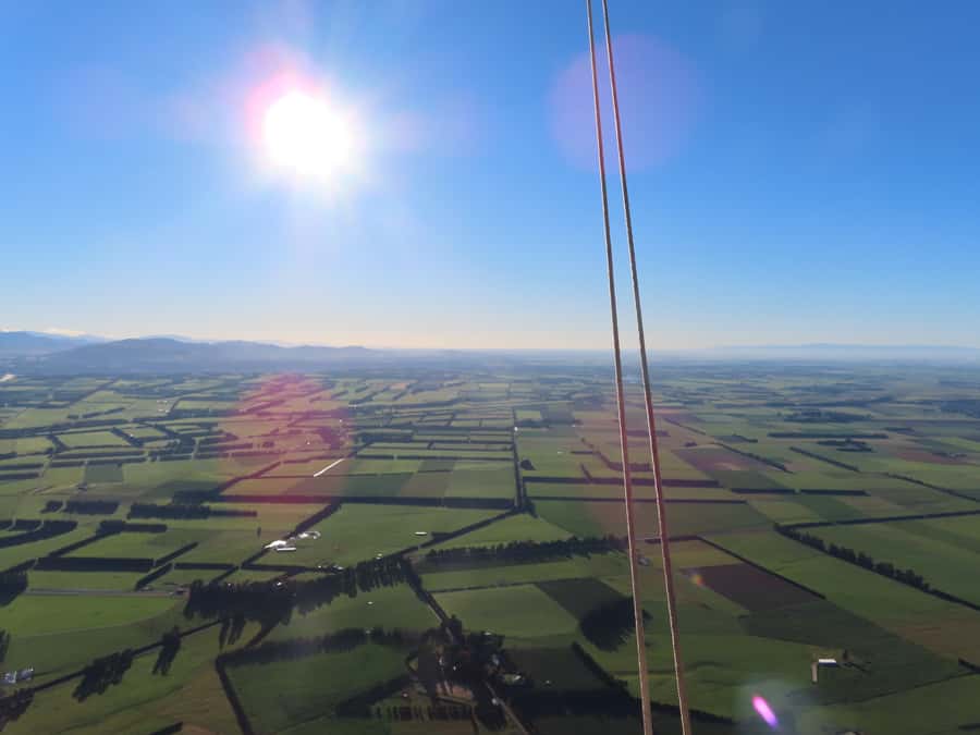 From Methven: Hot Air Balloon Flight in Canterbury with Wine - A quiet flight above Methven’s patchwork fields