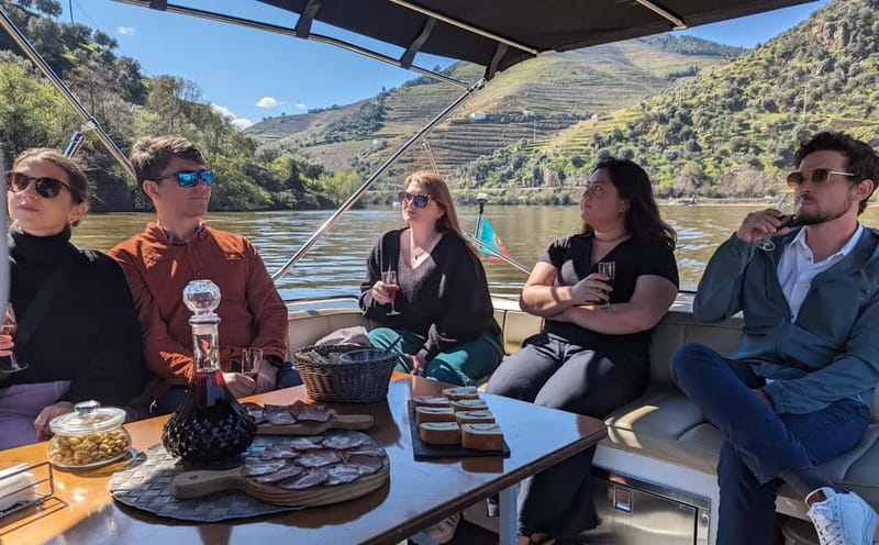 From Porto: Tastings at 2 Wineries, Chef's Lunch & Boat Tour - A private boat on the Douro near Pinhão