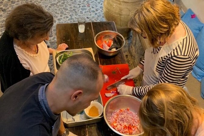 Greek Cuisine Cooking Class in Santorini with Recipes and Wine - Cooking Greek food in Megalochori