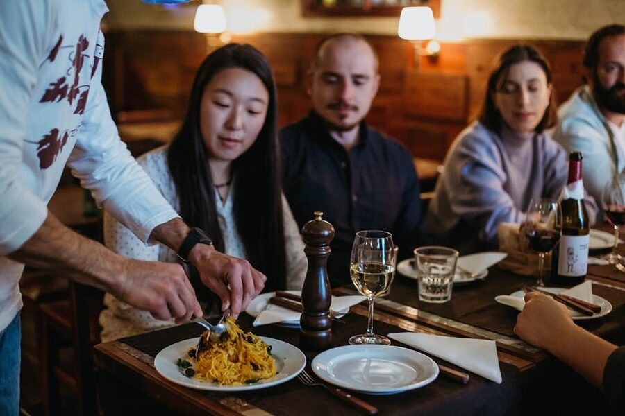 Lisbon: Evening Food & Wine Tour in Bairro Alto - Flame-roasted chouriço at Grapes & Bites
