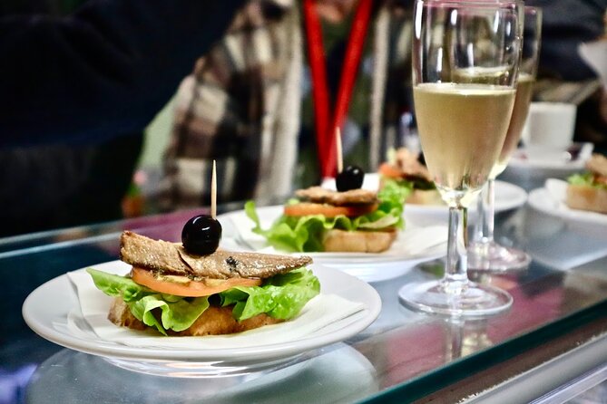 Lisbon Food Tour with 10+ Tastings of Local Delicacies & Wines - Baixa, Santa Justa Lift, and the city’s vertical problem