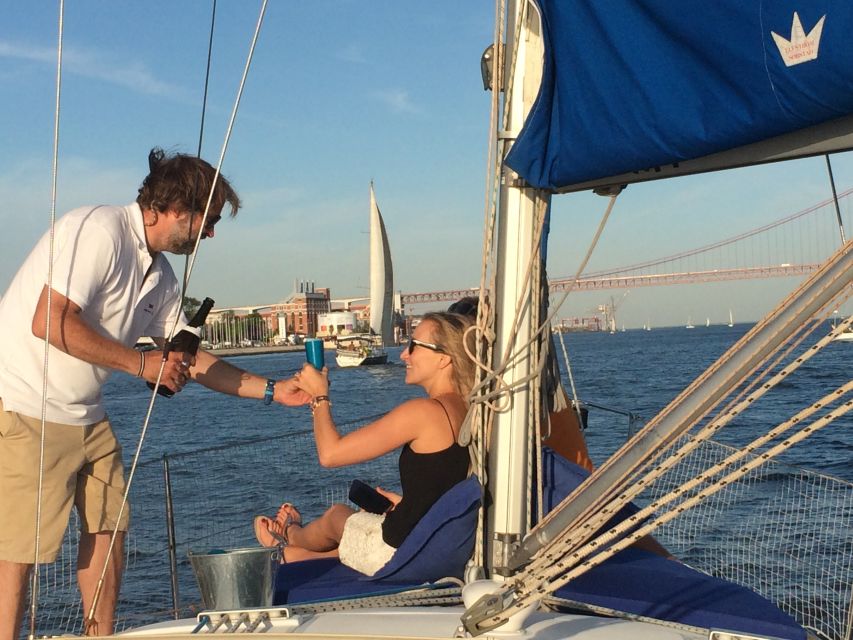 Lisbon: Private Sunset Sailing Tour with Champagne - The 25 de Abril Bridge at sunset