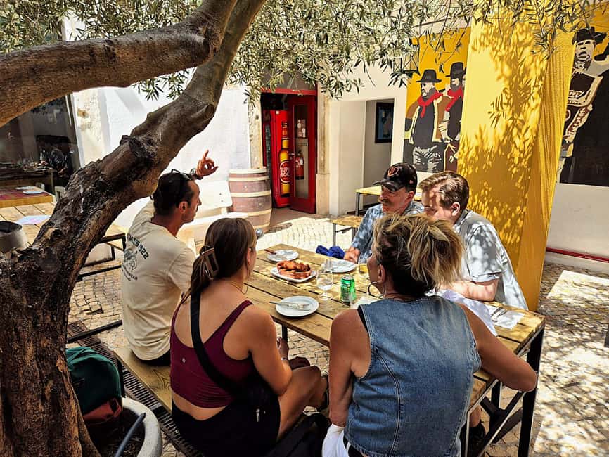 Lisbon Small-Group Food & Wine Tour Eat & Drink like a Local - Seafood rice and Bacalhau à Brás