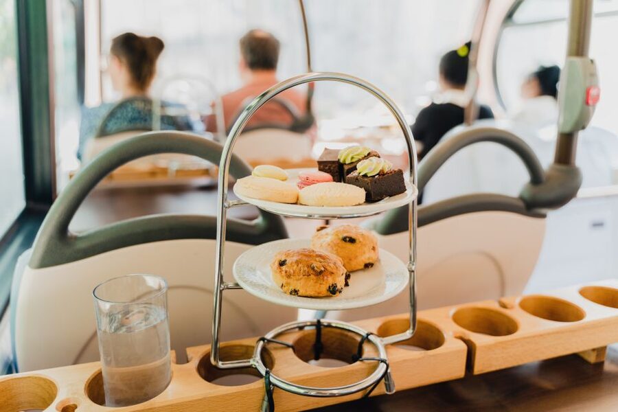 London: Afternoon Tea Bus with a Glass of Prosecco - The afternoon tea spread: sandwiches, scones, and cakes