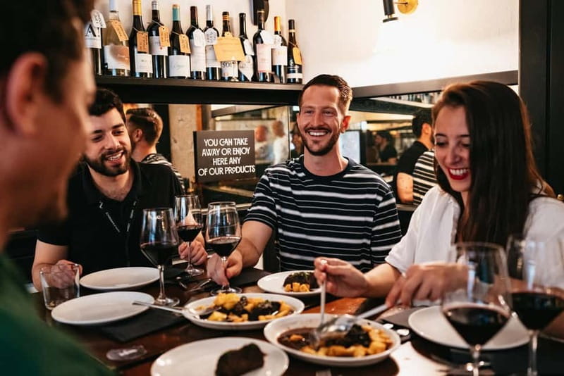 Madrid: Guided Tapas and Wine Tour with Rooftop Views - Iberian ham, sausages, and Plaza Mayor