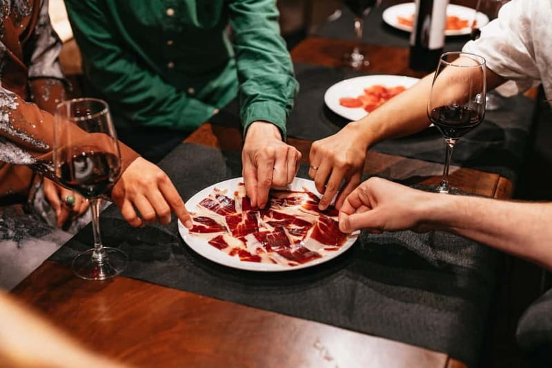 Madrid: Guided Tapas and Wine Tour with Rooftop Views - What the guides add to the experience
