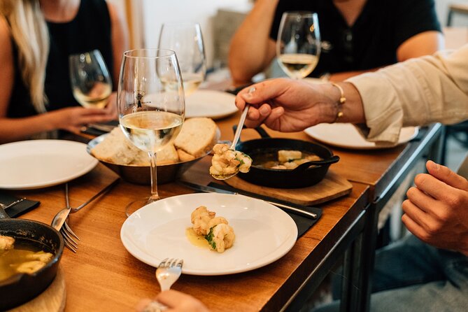 Madrid Tapas & Wine Tour with Rooftop Views and Local Guide - Beef cheeks and potatoes on Huertas Street