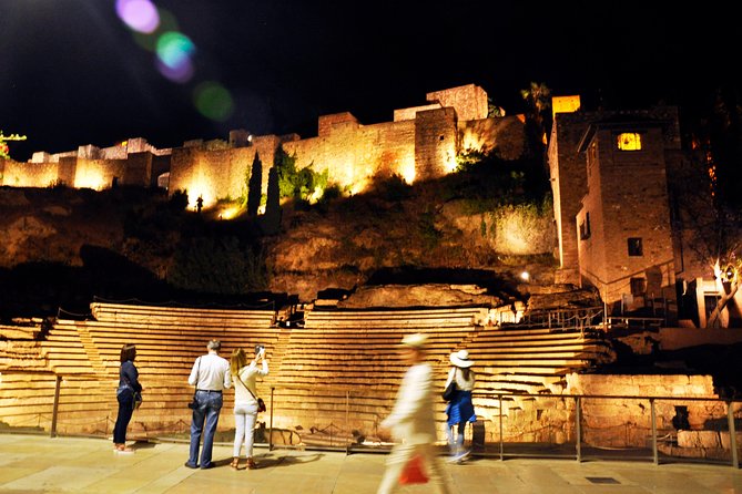 Malaga Wine & Tapas Small Group Guided Tour - Iberian ham inside a traditional ultramarinos