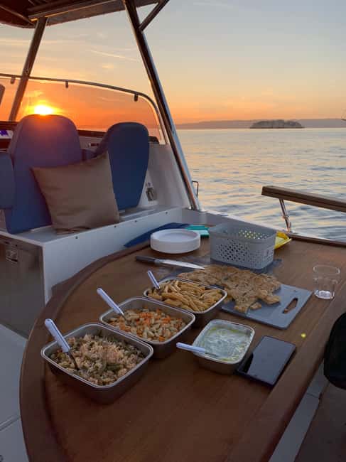 Marseille: Sunset Boat Cruise with Buffet and Organic Wine - The two-hour cove stop: swimming, photos, and dinner