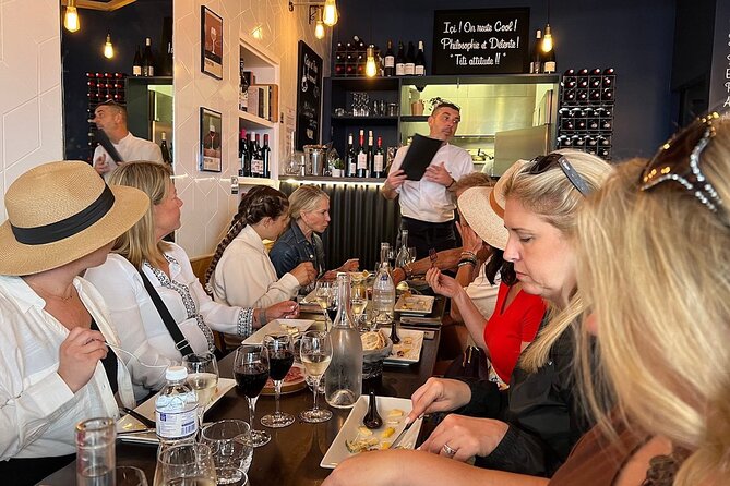 Montmartre Hill French Gourmet Food and Wine Tasting Walking Tour - Food stops that tell a French story