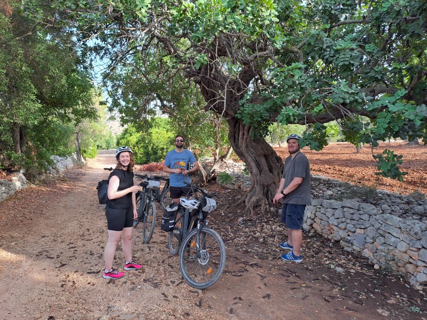 Ostuni: Guided e-bike tour + countryside tasting stop - Riding back through Ostuni’s historic center