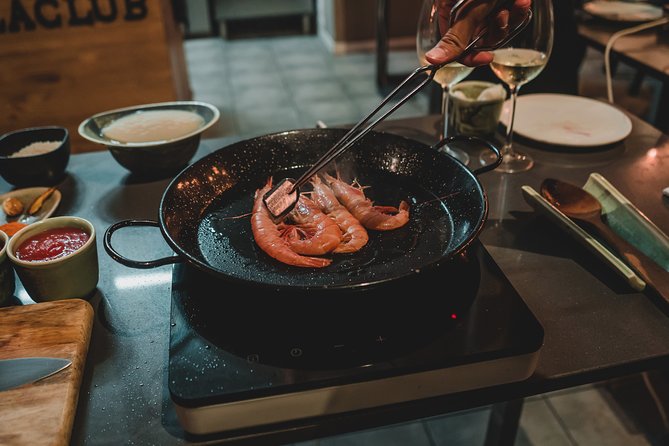 Paella Experience and Bottomless Wine in Barcelona - Timing, booking, and cancellation details