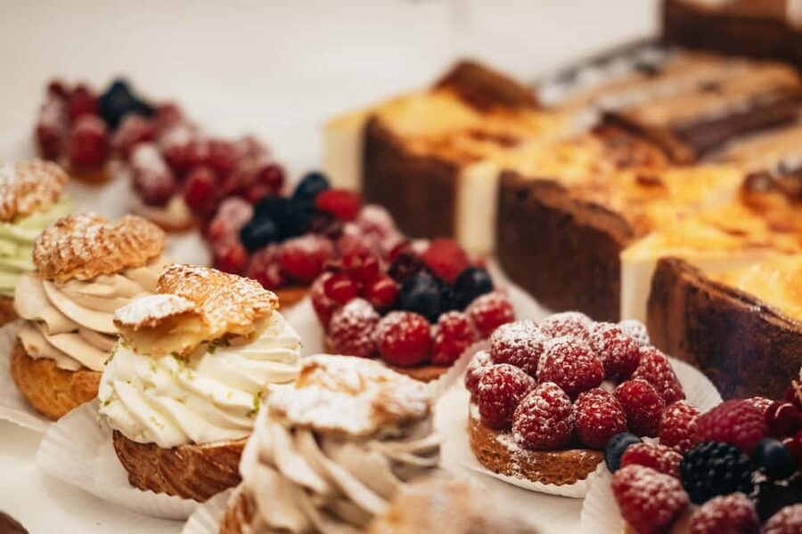 Paris: Gourmet Food Tour with Over 10 Tastings and Wine - First bites: bakery pastries and the jambon beurre