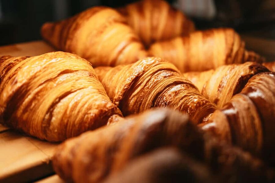 Paris: Gourmet Food Tour with Over 10 Tastings and Wine - A historic market and the route through central Paris