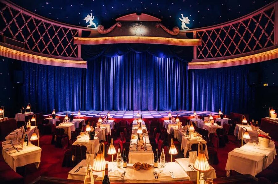 Paris: La Nouvelle Eve Cabaret Show with Champagne - Champagne, tables, and the practical cost of the evening