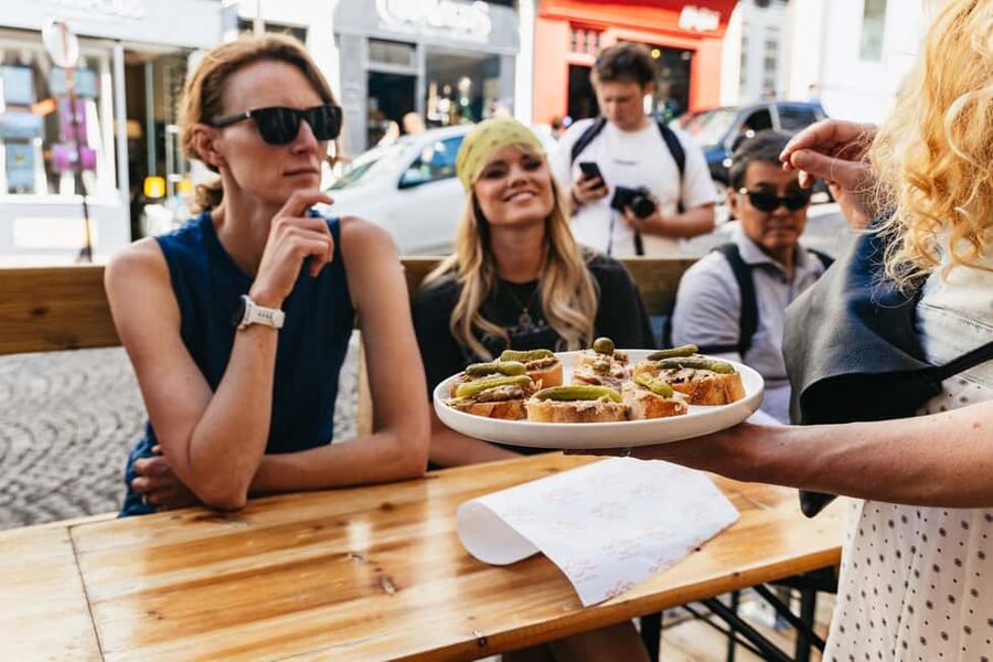 Paris: Montmartre Cheese, Wine & Pastry Guided Walking Tour - Walking uphill through Montmartre’s old streets