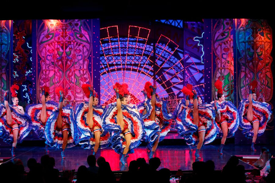 Paris: Moulin Rouge Show with Champagne and Drop-Off Service - A small table, a close room, and champagne