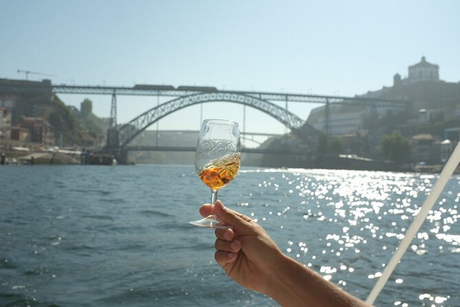 Porto: Douro River Boat Cruise with Port Wine and Snacks - The old bridge and Porto’s famous crossings