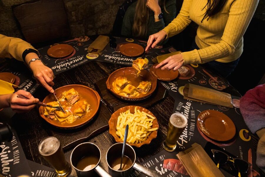 Porto: Food & Wine Tasting Walking Tour with Port Wine Cave - Bispo gives you a first taste of northern Portugal