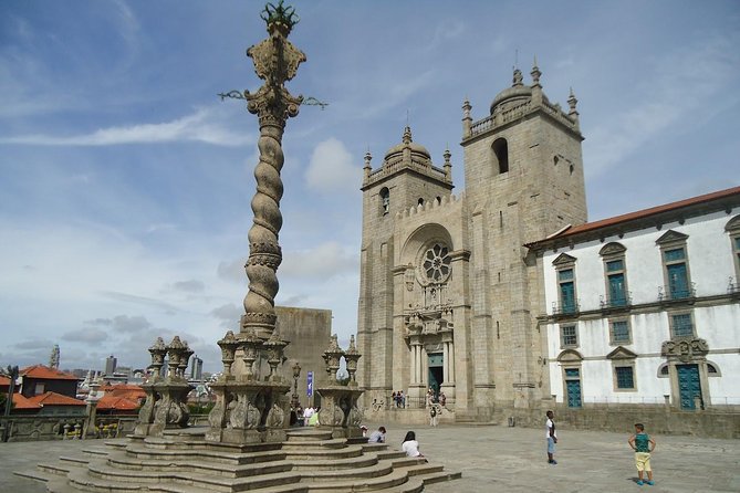 Porto Full Day City Tour Wine Tasting and Six Bridges Cruise - Walking through Porto’s medieval core