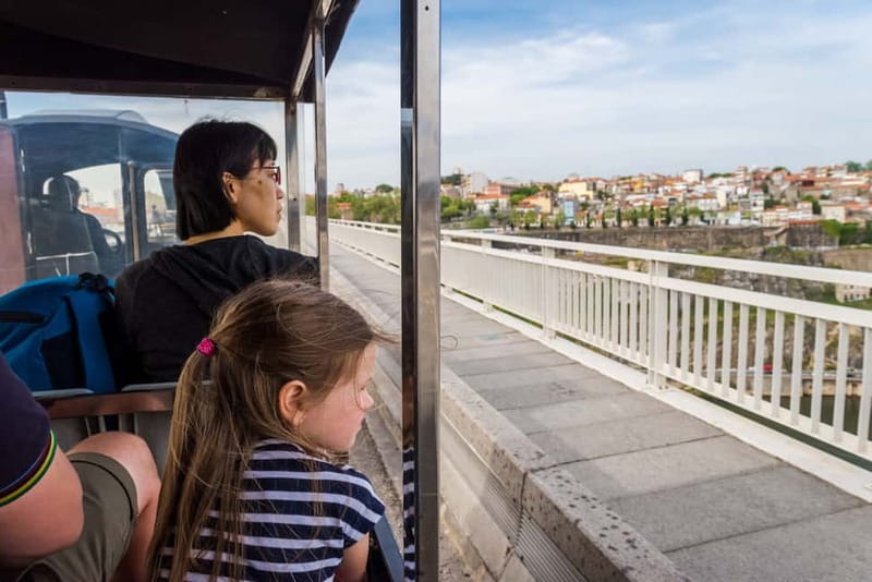 Porto: Magic Train Tour and Port Wine Cellar with Tastings - Crossing from city sights to Port wine