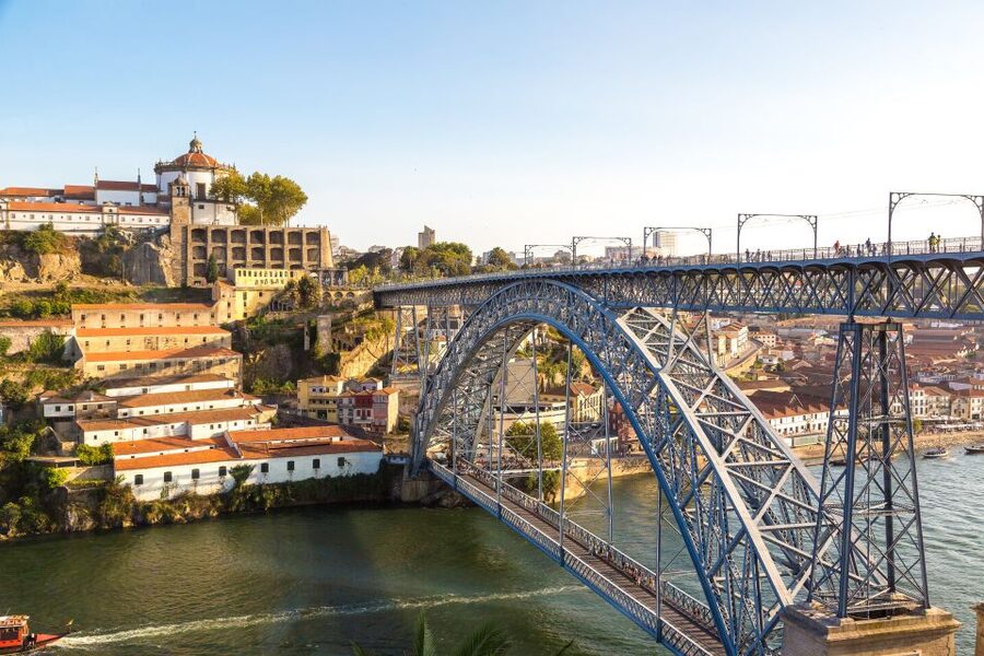 Porto: Tuk-Tuk Tour, Douro River Cruise, and Wine Tasting - Taking the rabelo boat beneath six bridges