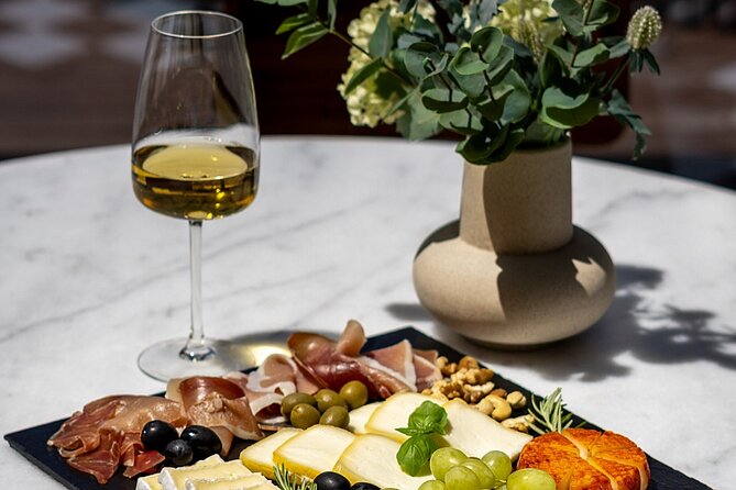 Porto Wine Tasting Experience with Portuguese Tapas Plate - Cheese, cured ham, biscuits, and homemade jam
