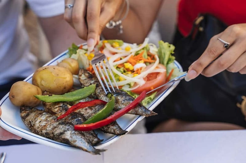 Private Lisbon Food Tour in Baixa with Wine & Local Delights - Rua da Vitória, petiscos, and Lisbon’s rebuilt center