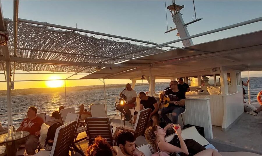 Rhodes: Sunset Cruise with Live Music, Wine & Greek Buffet - Greek buffet, local wine, and the bar