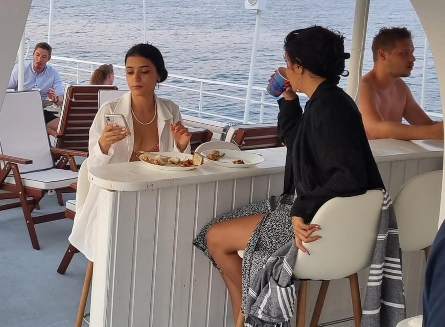 Rhodes: Sunset Cruise with Live Music, Wine & Greek Buffet - Kallithea Springs and the late-day swim